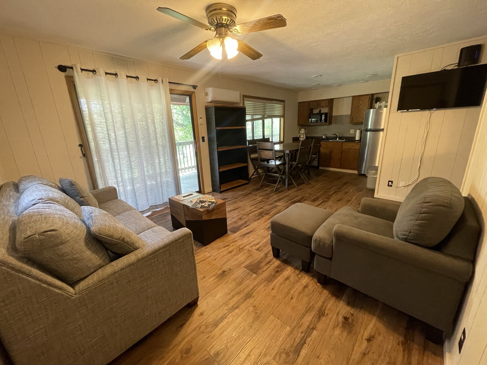 Relax in style: a cozy, modern living room perfect for unwinding after a day of adventure.